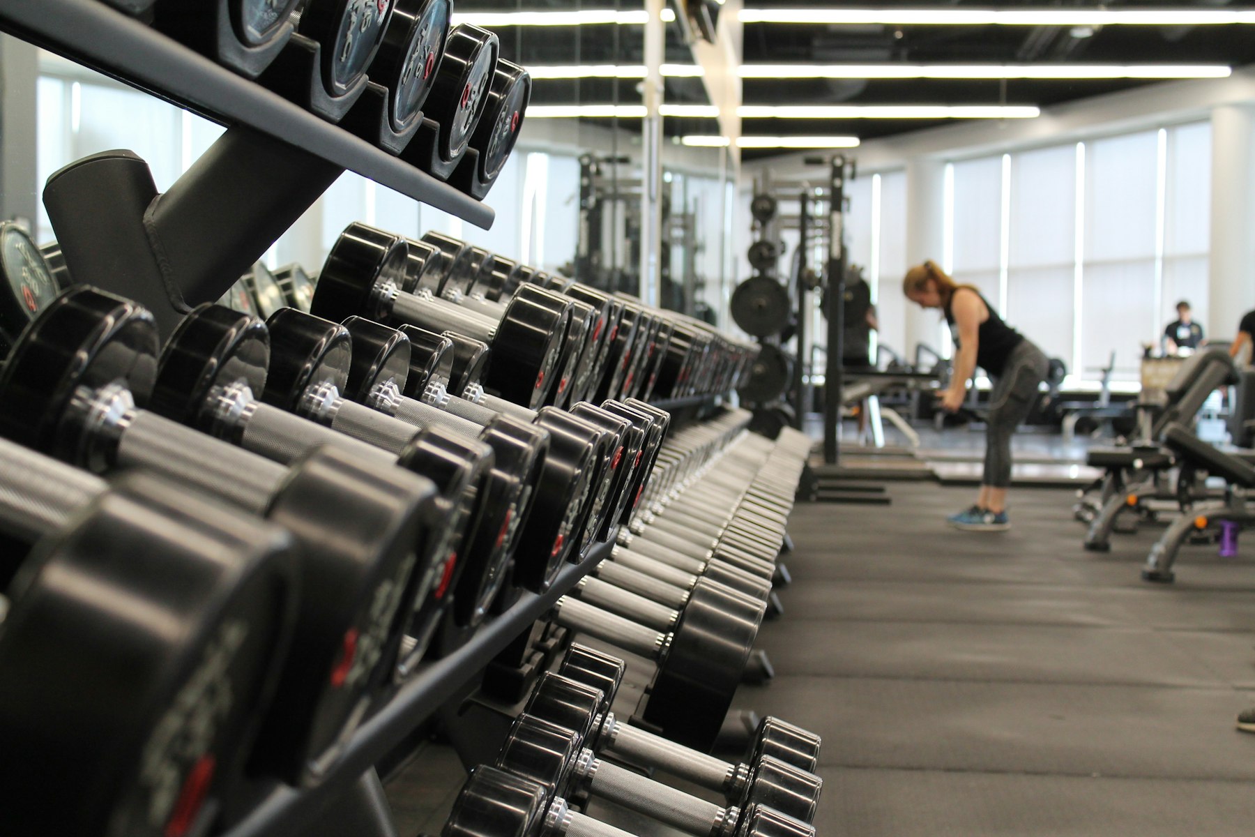 Dumbbell rack in a dark gym